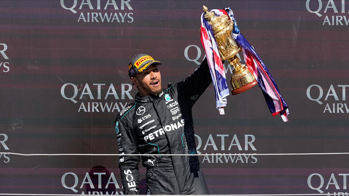 Mercedes driver Lewis Hamilton of Britain celebrates on the podium after winning the British Formula One Grand Prix race at the Silverstone racetrack, Silverstone, England, Sunday, July 7, 2024.  - (AP Photo/Luca Bruno)


